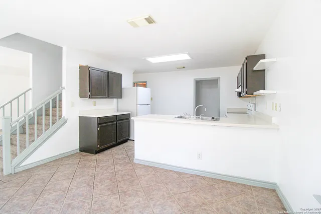 a bathroom with a sink a mirror and a bathtub