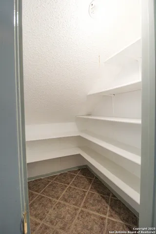 a view of an empty walk in closet