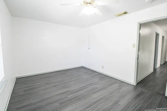 a view of an empty walk in closet