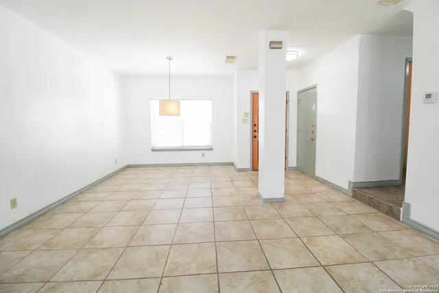 a view of an empty room and window