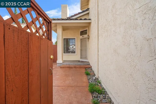 a view of a porch with a door and a wooden door
