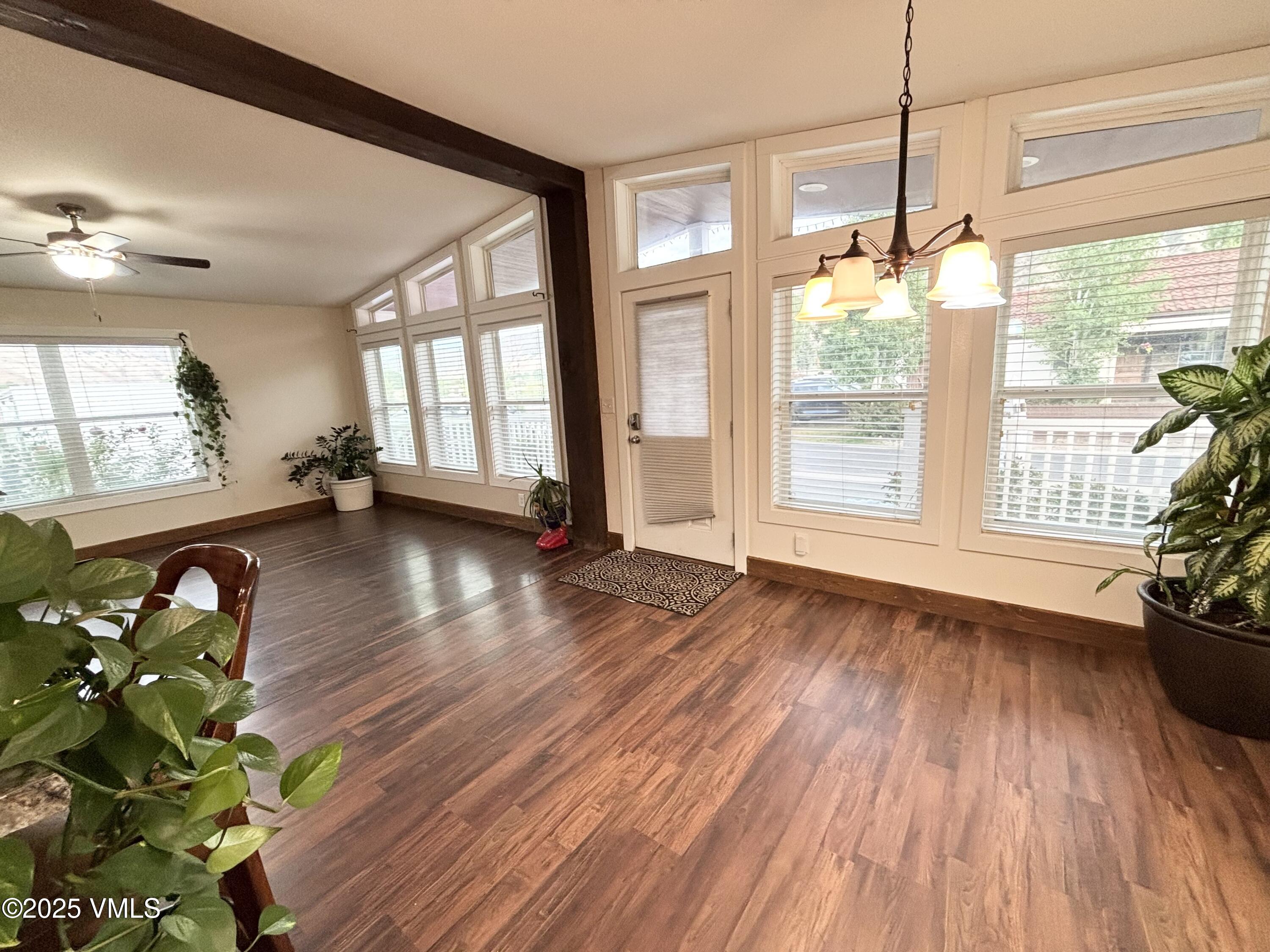 66 Bluegill Loop Gypsum, CO 81637 - Photo 12 of 37 a view of an empty room with wooden floor and a window