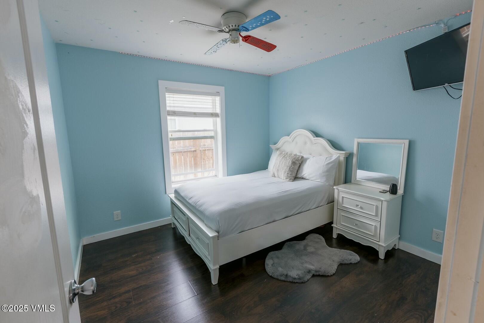 66 Bluegill Loop Gypsum, CO 81637 - Photo 20 of 37 a bedroom with a bed and flat screen tv