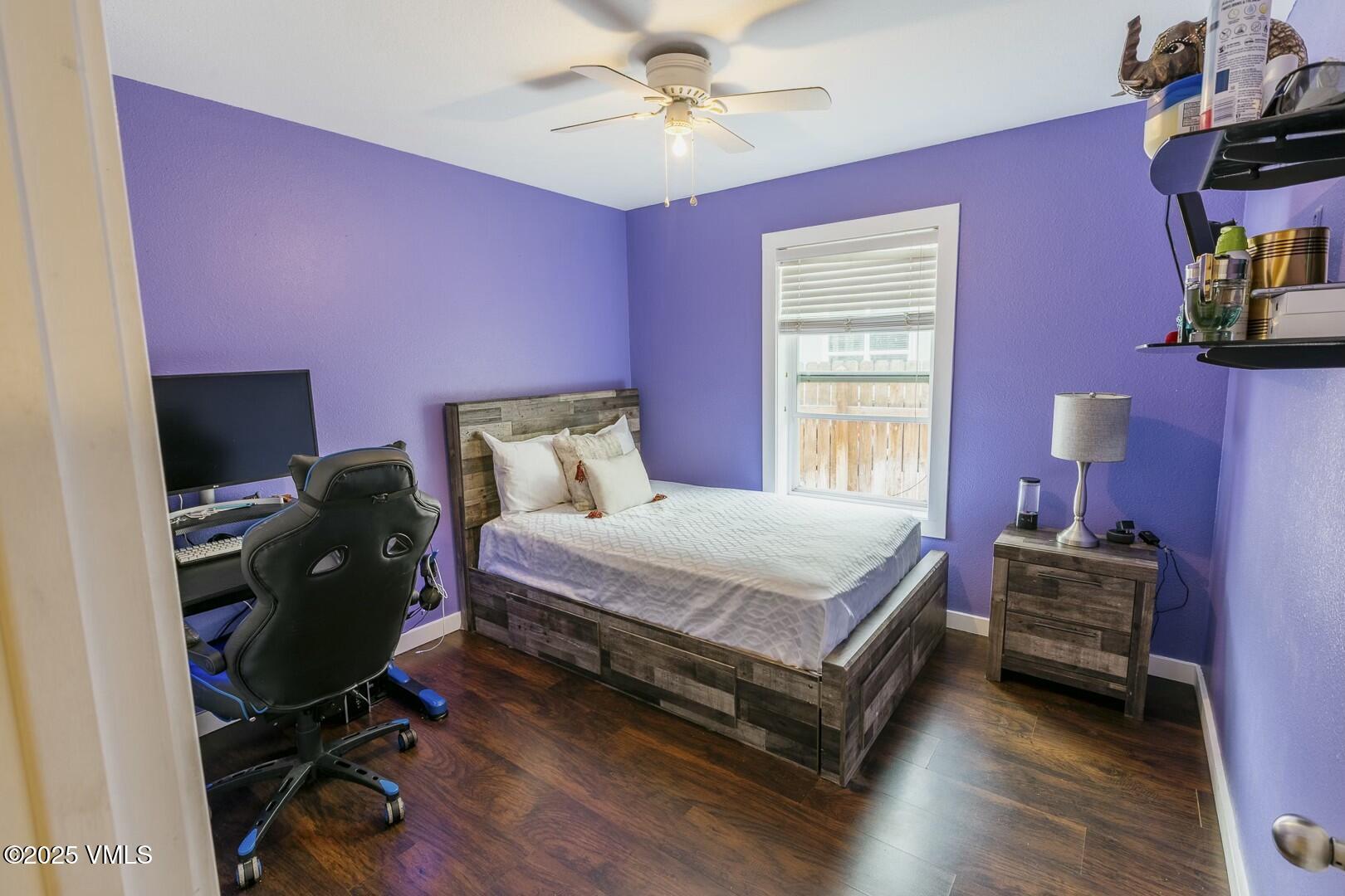 66 Bluegill Loop Gypsum, CO 81637 - Photo 22 of 37 a bedroom with a bed and a chandelier