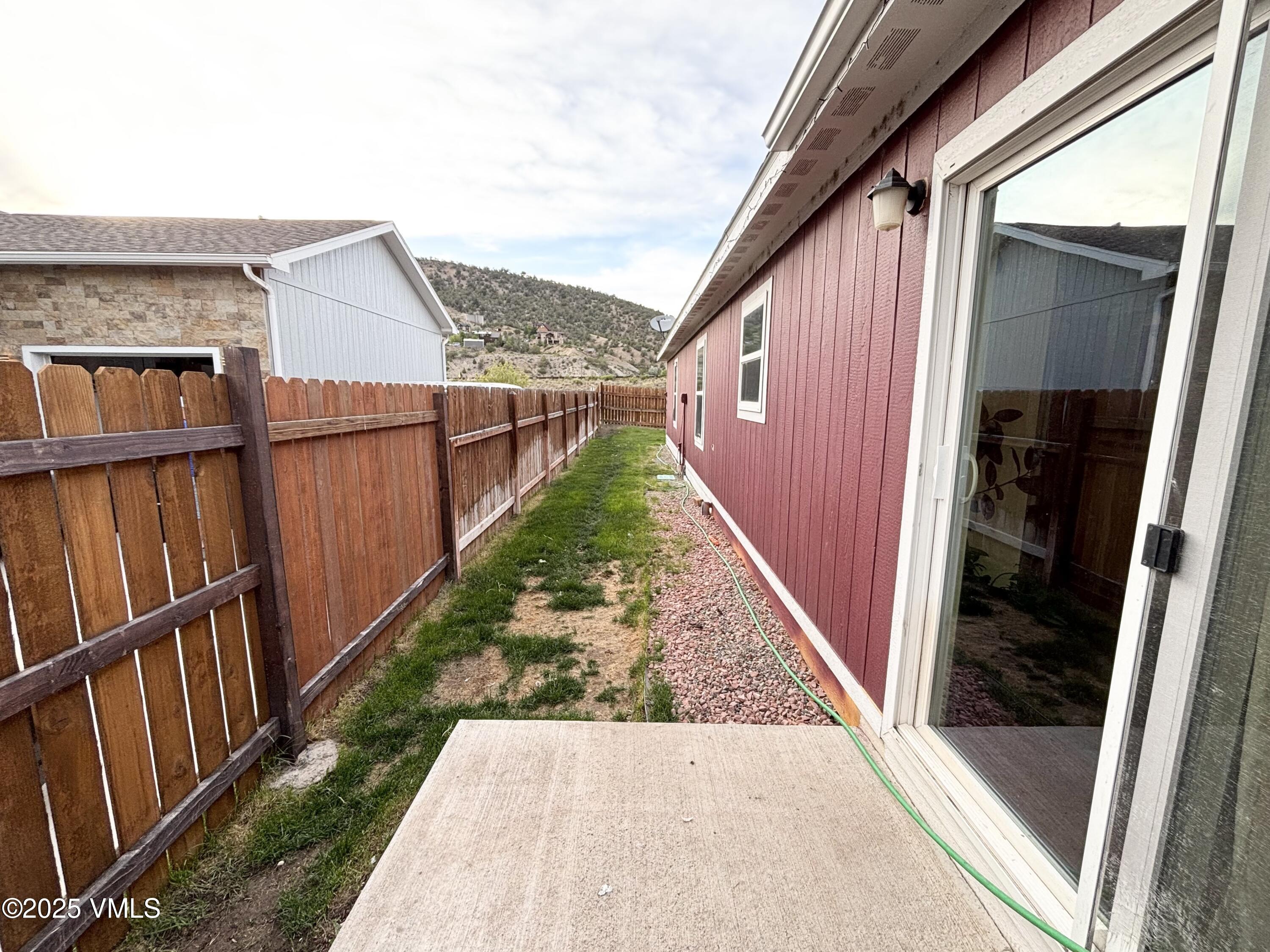 66 Bluegill Loop Gypsum, CO 81637 - Photo 27 of 37 a view of a balcony with wooden floor and fence