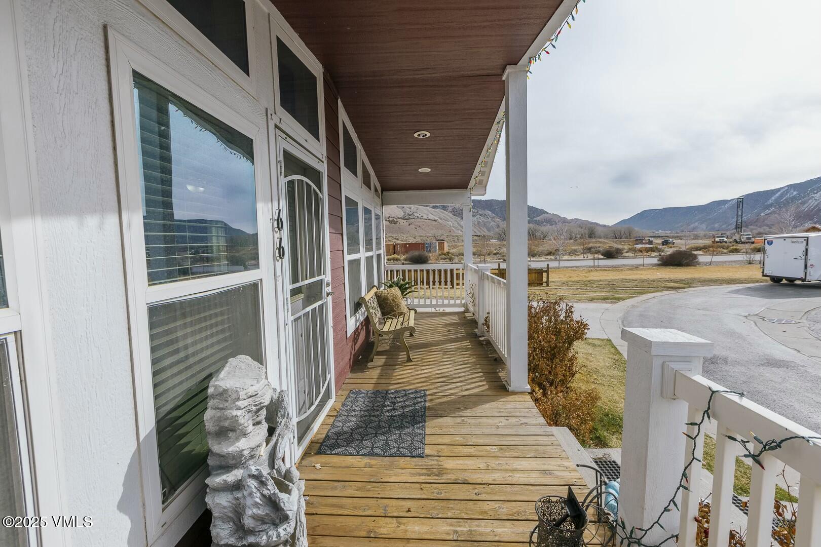 66 Bluegill Loop Gypsum, CO 81637 - Photo 3 of 37 a view of a balcony with dining table and chairs