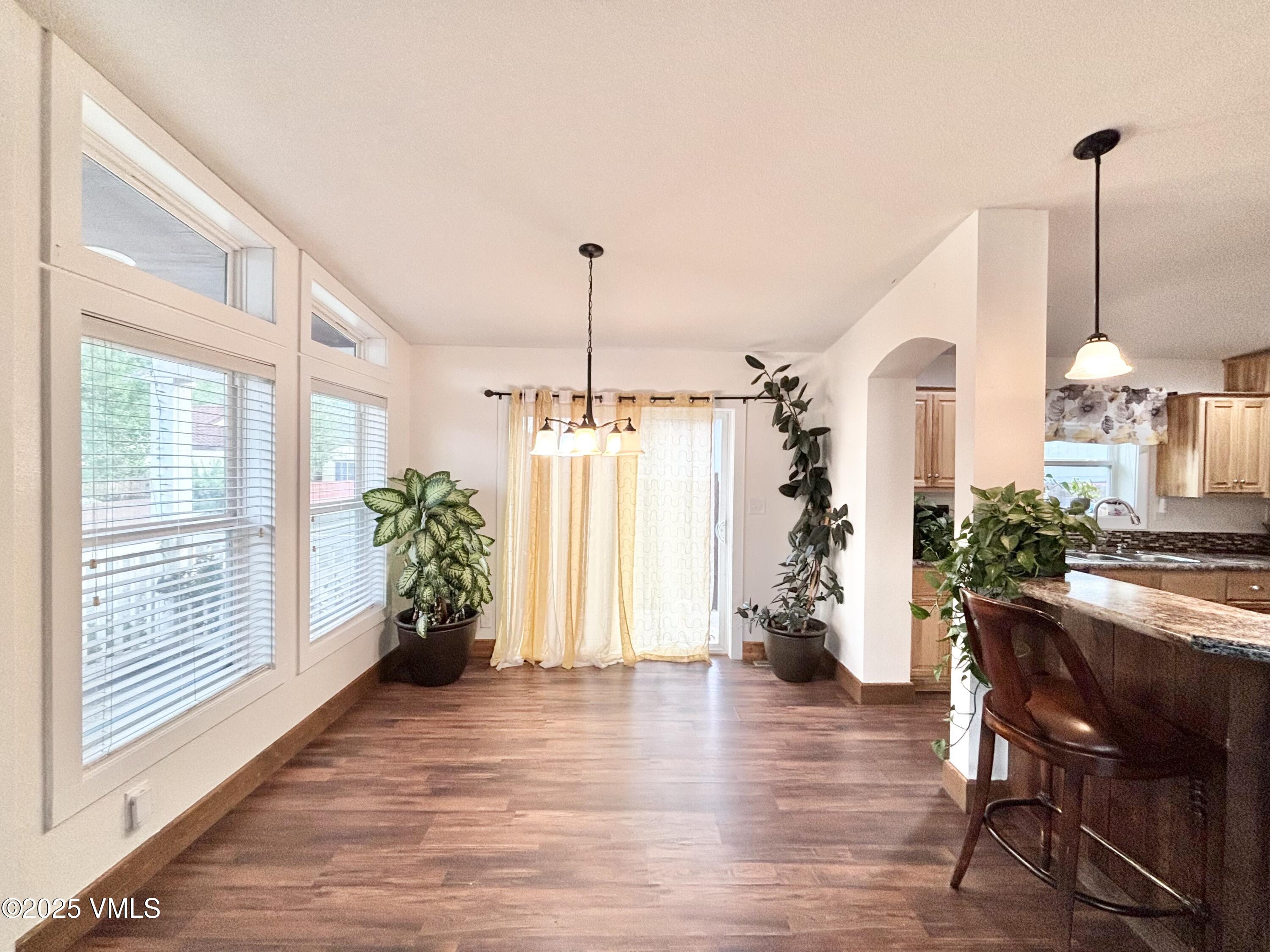 66 Bluegill Loop Gypsum, CO 81637 - Photo 4 of 37 a view of a room with furniture window and wooden floor