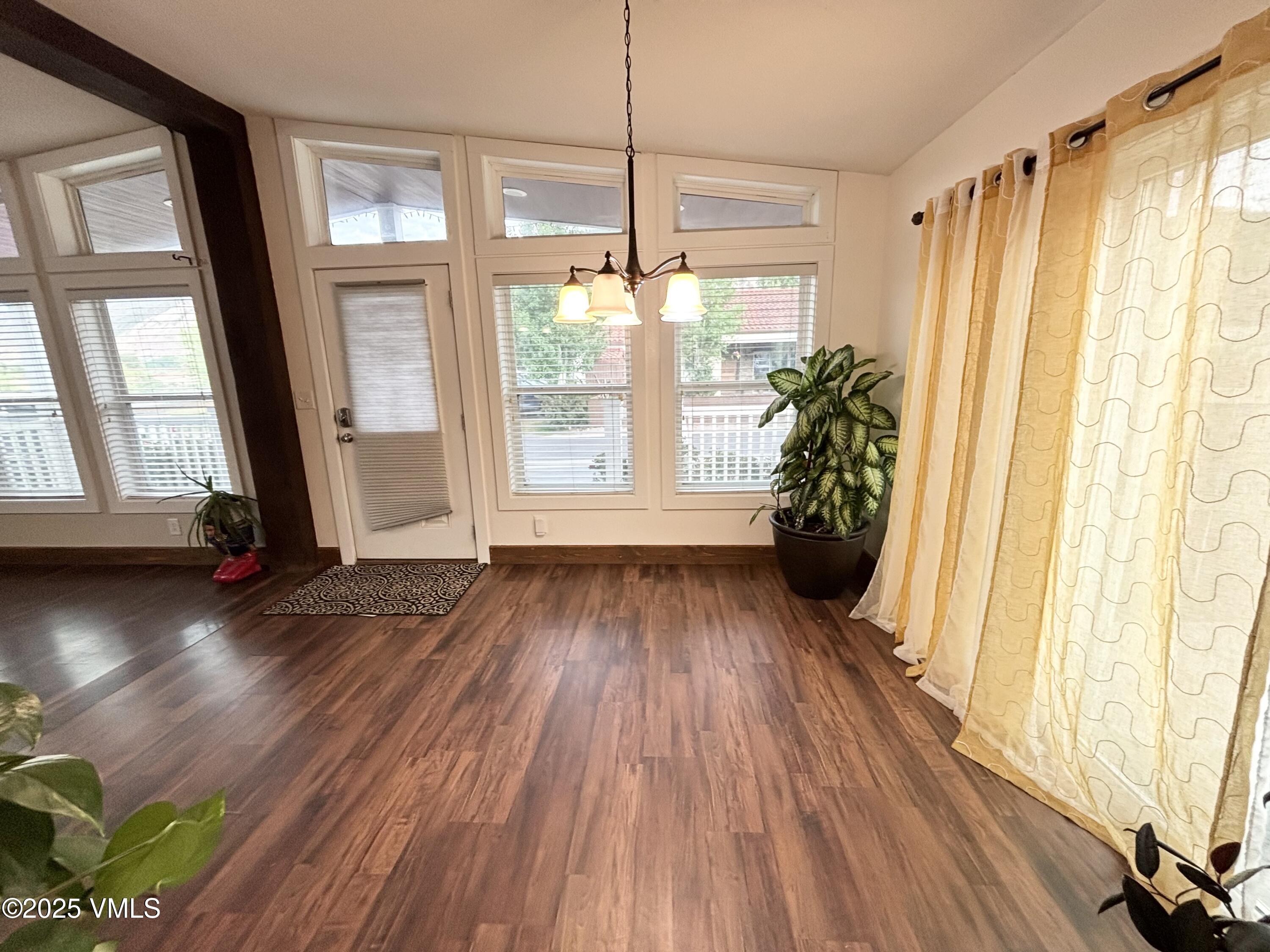 66 Bluegill Loop Gypsum, CO 81637 - Photo 5 of 37 a view of a room with wooden floor and front door