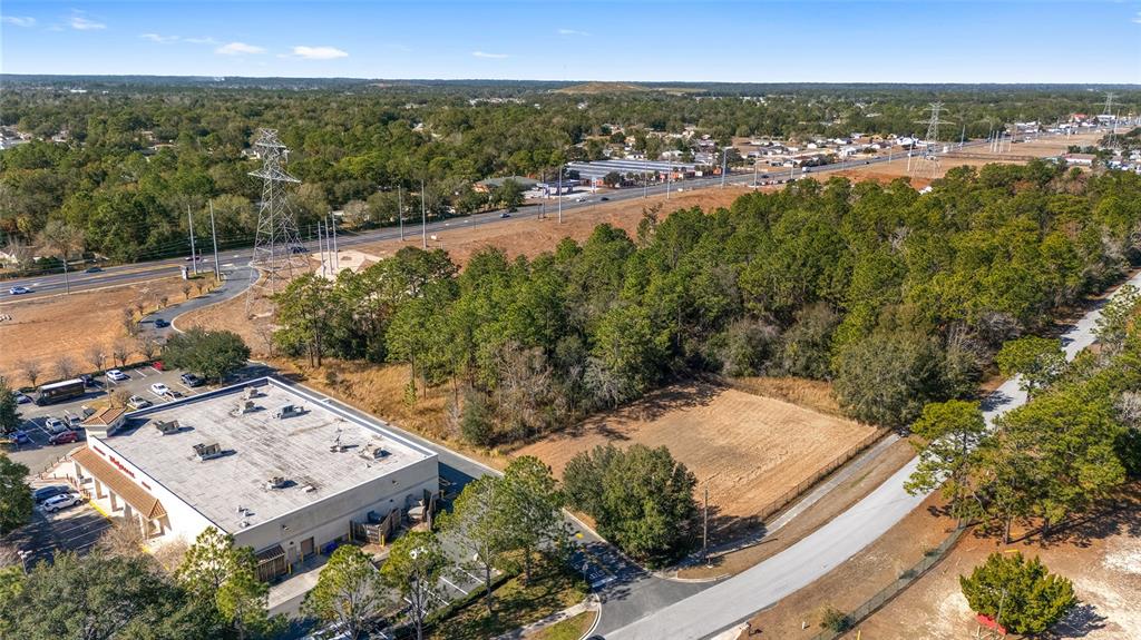 Maricamp Road Belleview, FL 34420 - Photo 2 of 8 an aerial view of a house with a yard