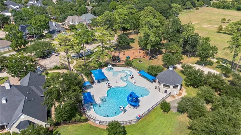 an aerial view of a house with yard swimming pool and outdoor seating