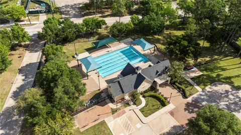an aerial view of a house with swimming pool and outdoor space