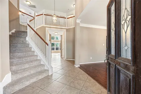 a view of entryway with stairs and a window