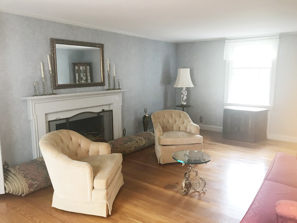 1 Longfellow Road Wellesley, MA 02481 - Photo 4 of 6 a living room with furniture and a fireplace