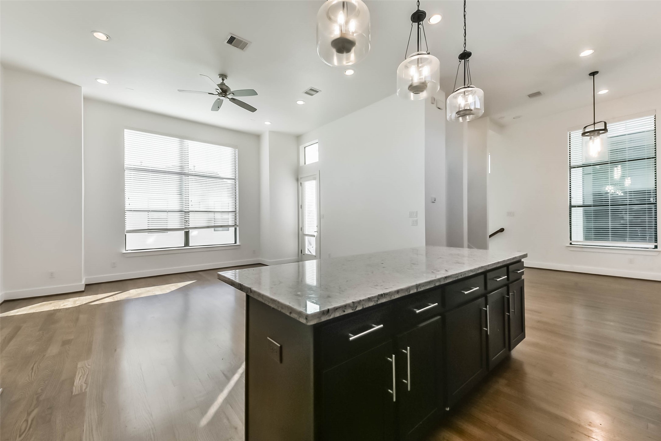 1810 Thompson Street Houston, TX 77007 - Photo 13 of 32 an empty room with wooden floor and large window