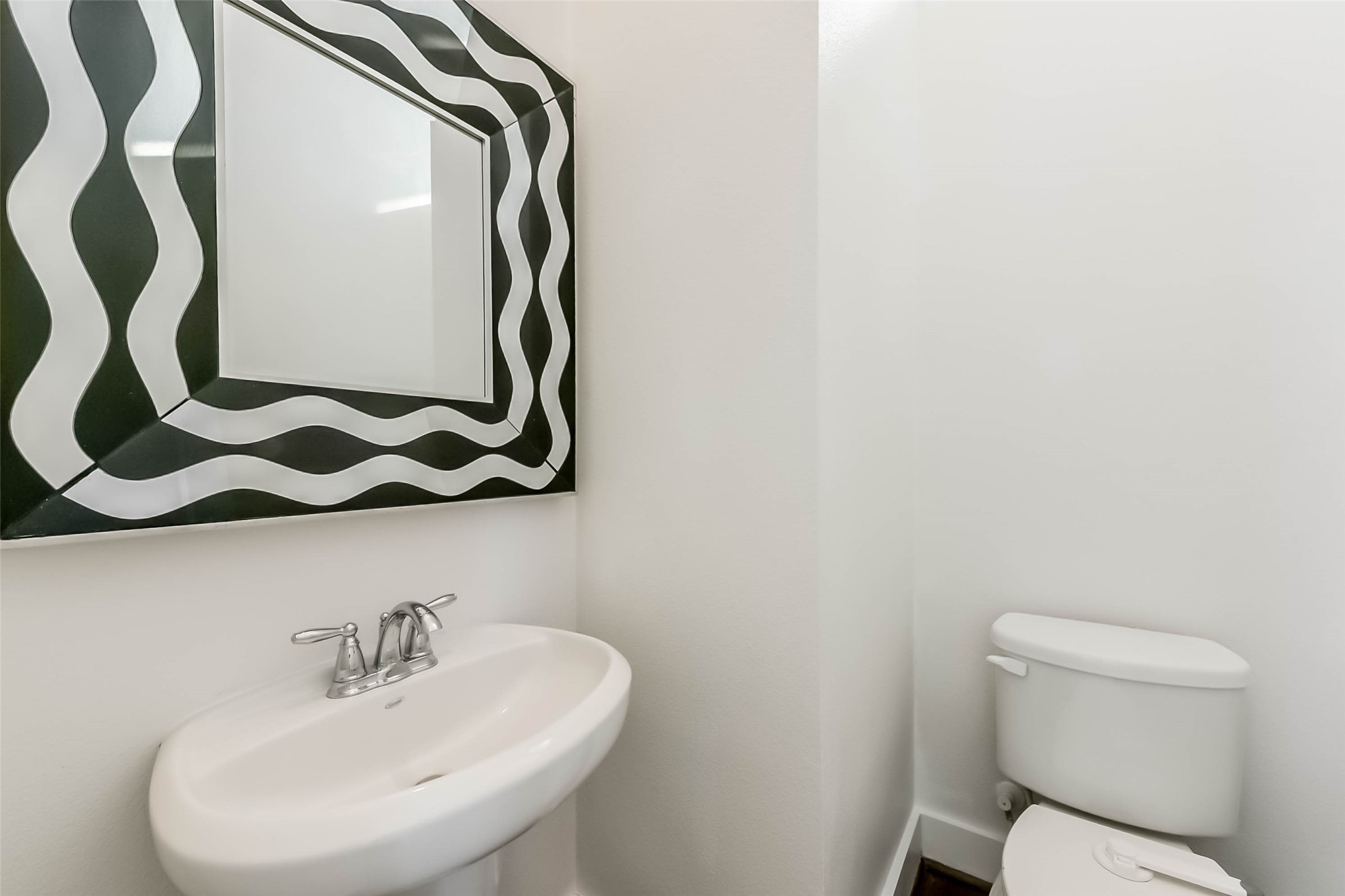 1810 Thompson Street Houston, TX 77007 - Photo 17 of 32 a bathroom with a sink and mirror with toilet