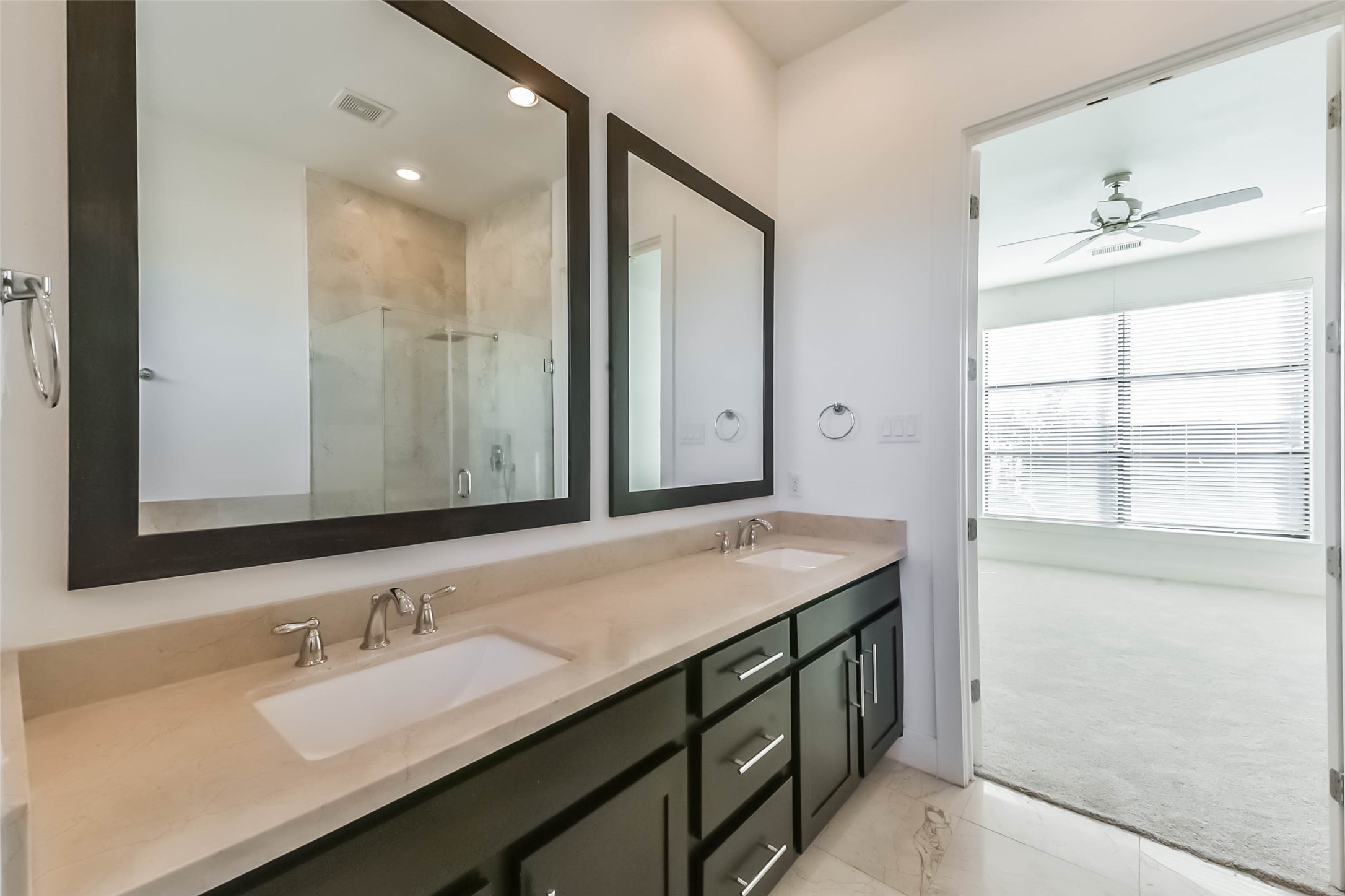 1810 Thompson Street Houston, TX 77007 - Photo 27 of 32 a bathroom with a granite countertop sink and a mirror