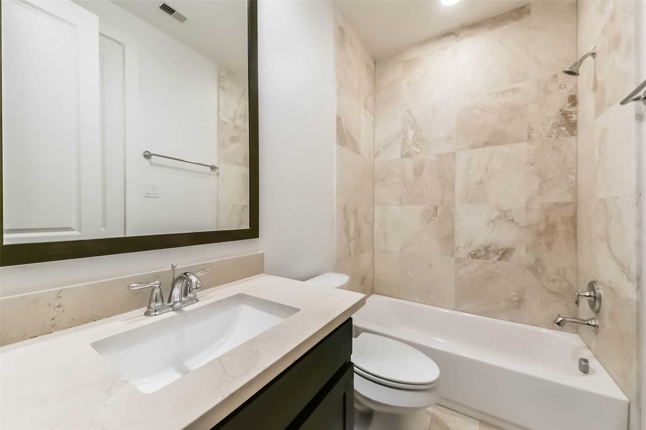 1810 Thompson Street Houston, TX 77007 - Photo 31 of 32 a bathroom with a granite countertop sink toilet and shower
