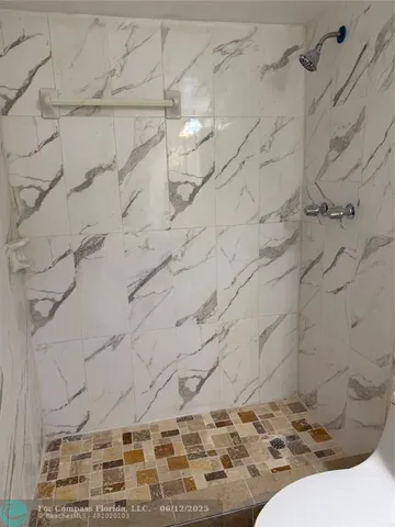 a bathroom with a sink toilet and mirror