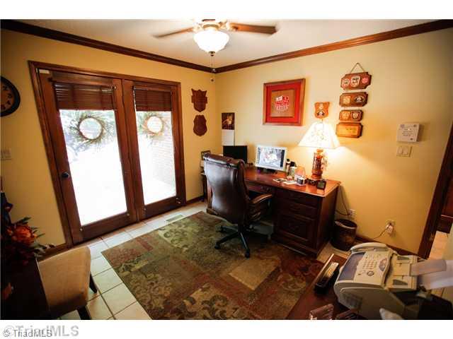 5401 Edgerunner Road Oak Ridge, NC 27310 - Photo 14 of 16 Other. This room is being used as an office. It has tile floors and its own private entrance. It has a closet so a bedroom would be a possible use as well.