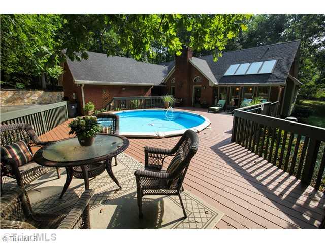 5401 Edgerunner Road Oak Ridge, NC 27310 - Photo 16 of 16 Patio/Deck. This deck is made for entertaining. Enjoy the round pool in summers, bring your meals outside or just sit and relax.