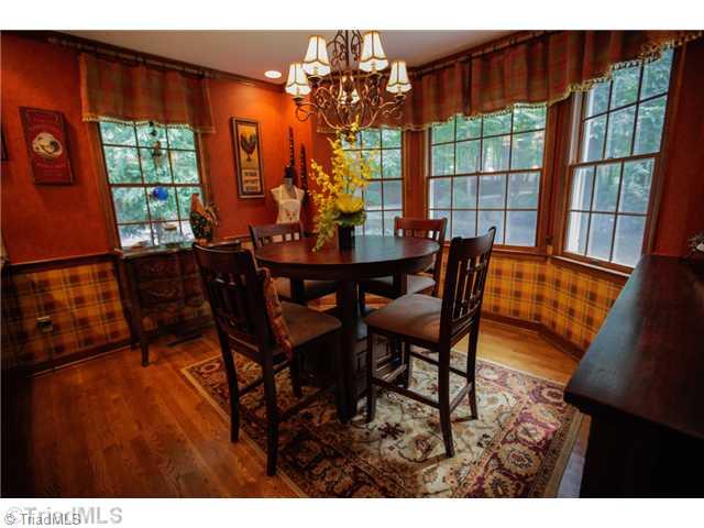 5401 Edgerunner Road Oak Ridge, NC 27310 - Photo 4 of 16 Breakfast. Cozy breakfast nook with lots of windows looks out into front yard.