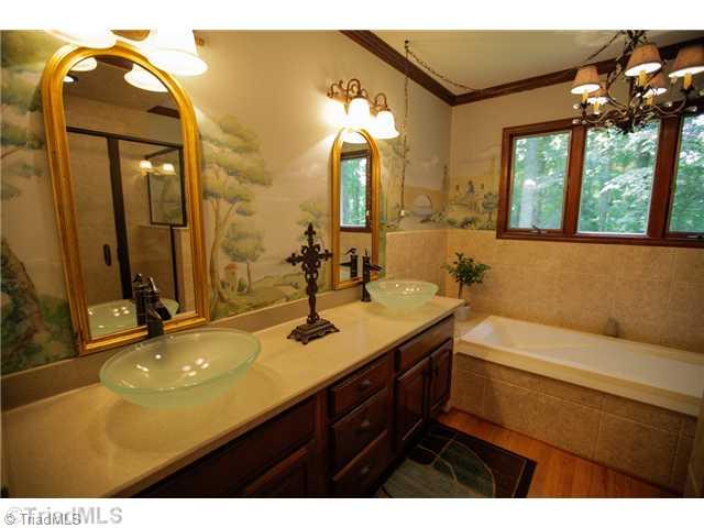 5401 Edgerunner Road Oak Ridge, NC 27310 - Photo 9 of 16 Master Bath/Spa. Master Bath has been completely upgraded but the owners kept the mural which lends itself to "old world" charm.