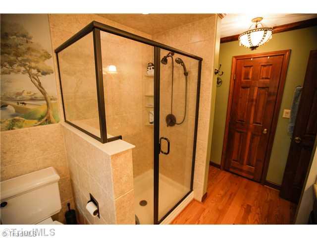 5401 Edgerunner Road Oak Ridge, NC 27310 - Photo 10 of 16 Master Bath/Spa. Another view of the master bath shows the oversized beautifully tiled shower.