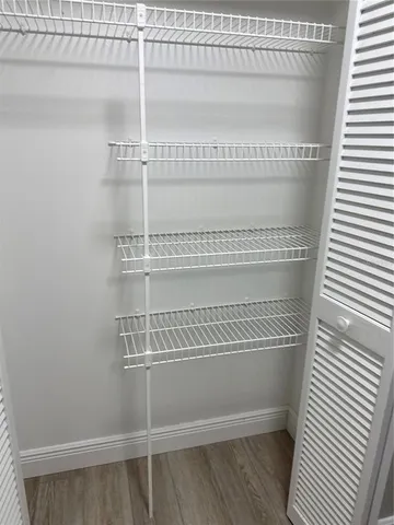 a view of a room with racks on the wall