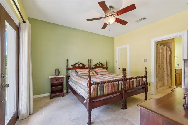 a bed room with a bed and a chandelier