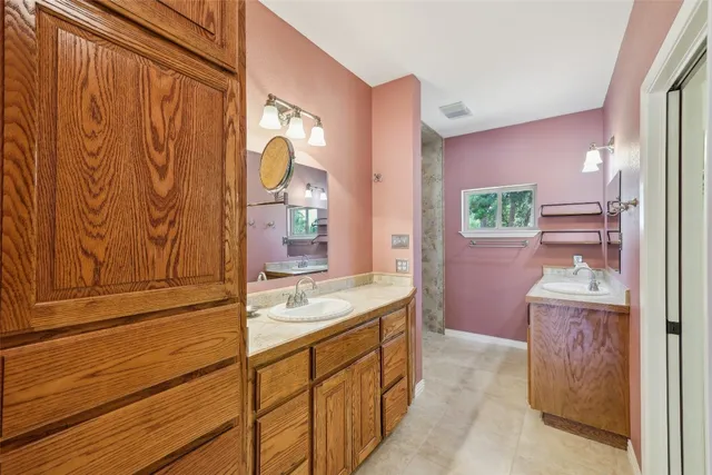 a bathroom with a sink a vanity and a mirror