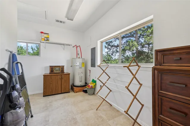 a view of room with window and furniture