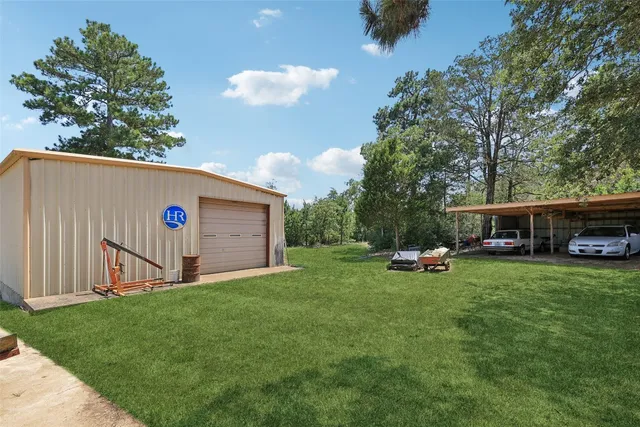 a view of a backyard with furniture and a fire pit