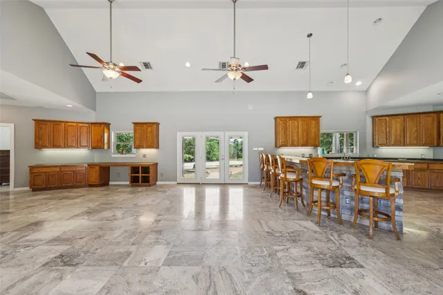 a view of a livingroom with furniture and a ceiling fan