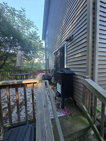a balcony view with a seating space