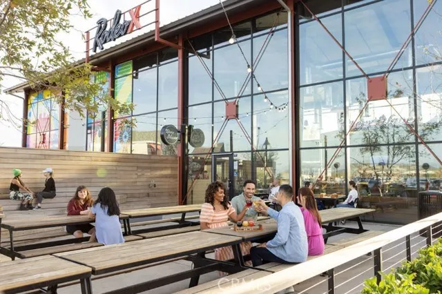 a view of a street with a flower garden