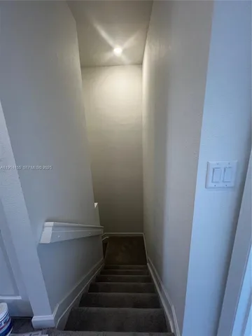 a view of a storage & utility room with closet