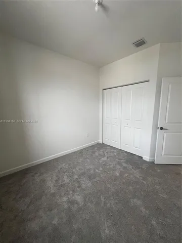 an empty room with a fireplace
