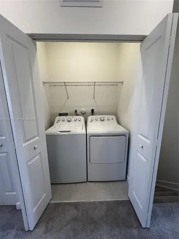 a view of a wooden deck with a backyard