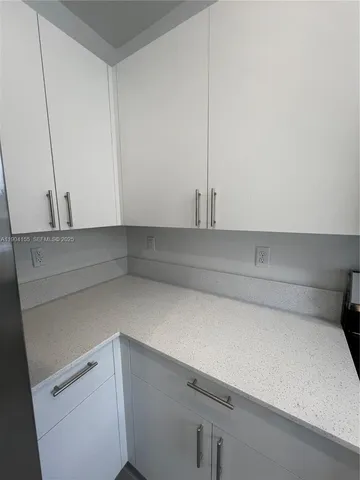 a kitchen with stainless steel appliances granite countertop a sink and a stove