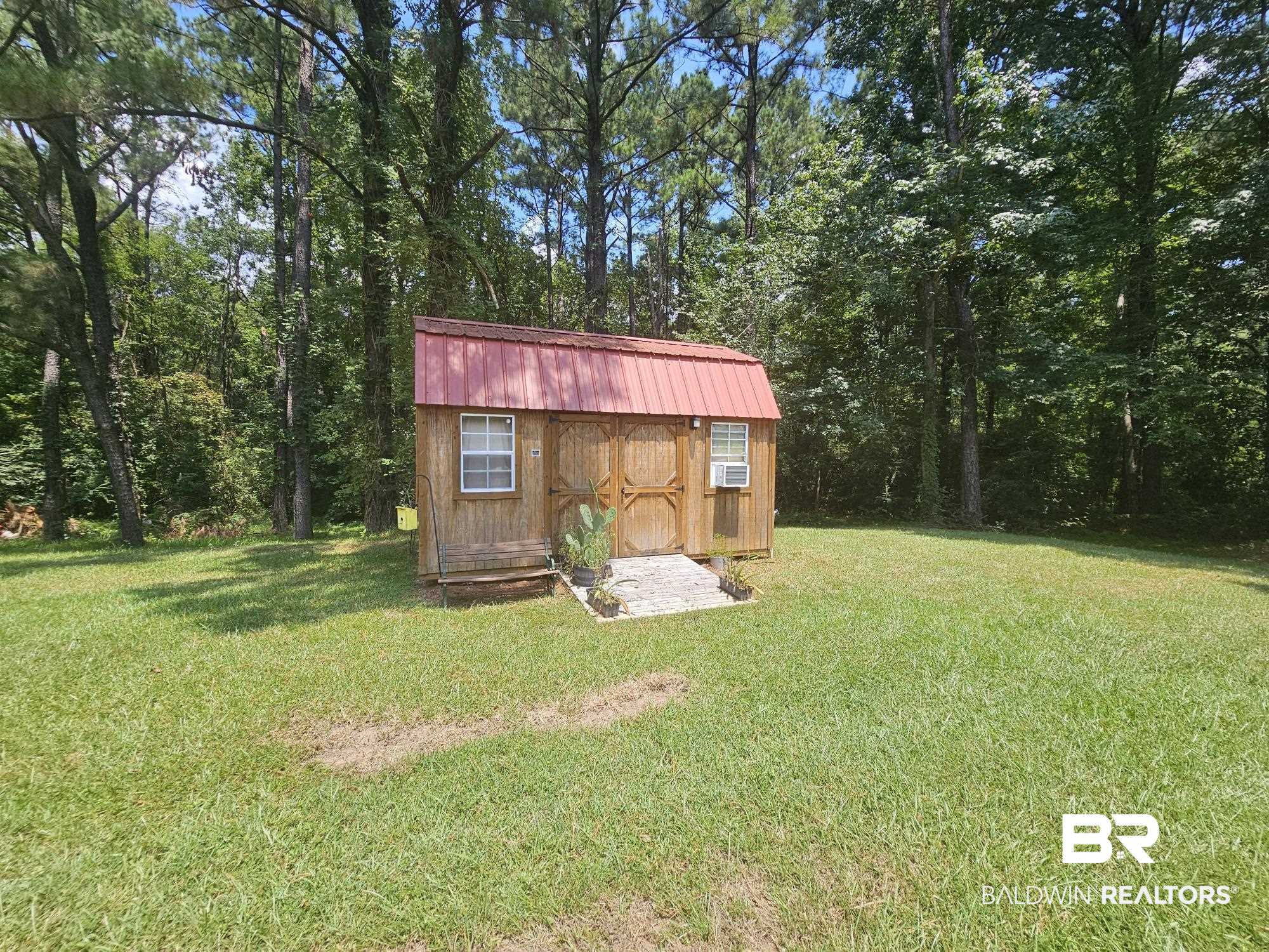 190 Magnolia Court Axis, AL 36505 - Photo 5 of 28 View of yard featuring a storage shed