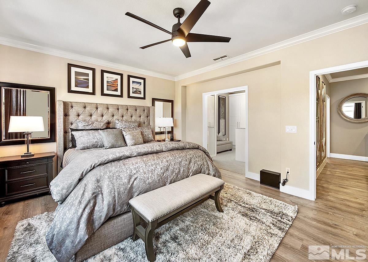 2552 Country Falls Lane Reno, NV 89521 - Photo 12 of 40 a bedroom with a large bed and a couch