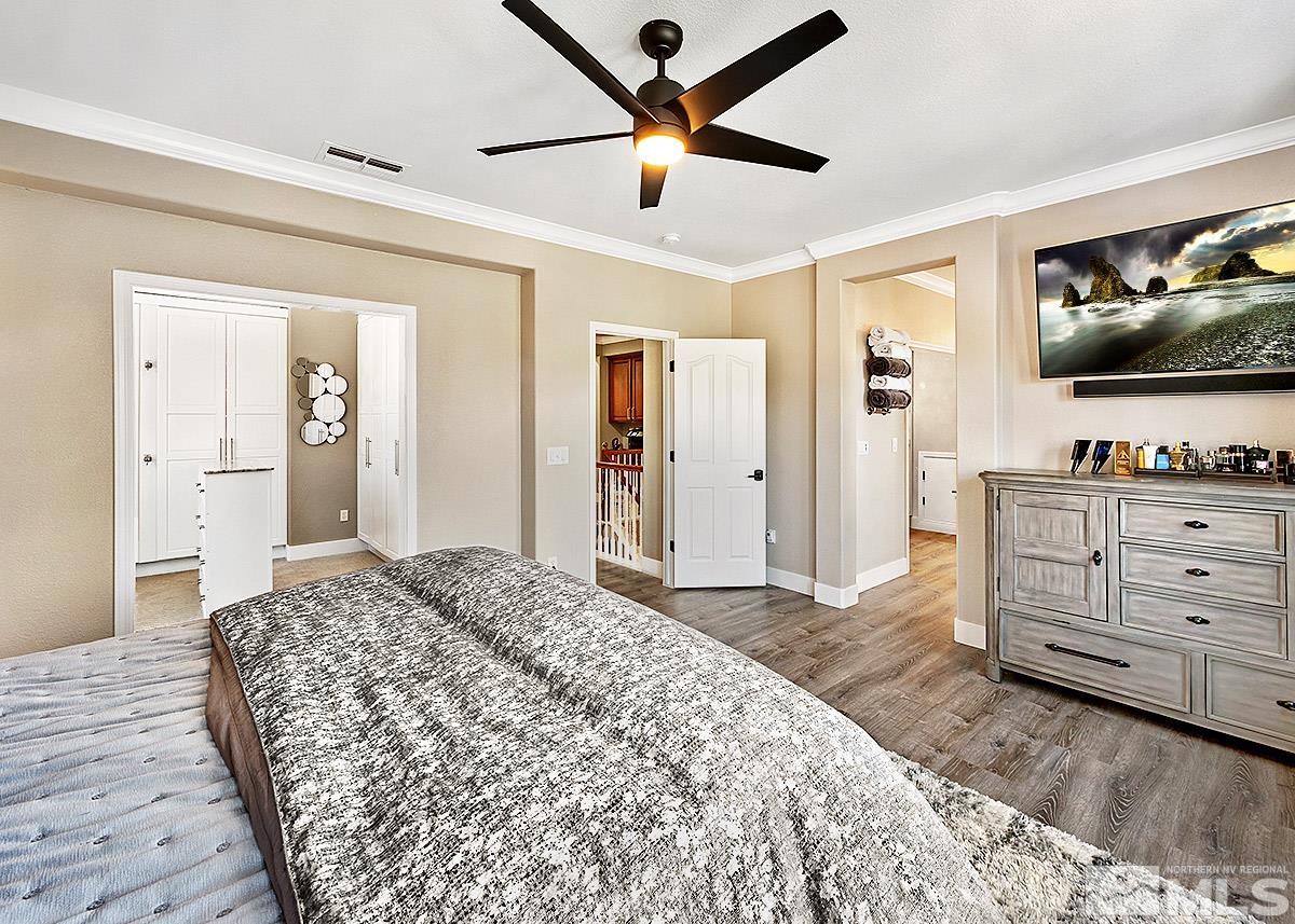 2552 Country Falls Lane Reno, NV 89521 - Photo 13 of 40 a bedroom with a bed and a flat screen tv