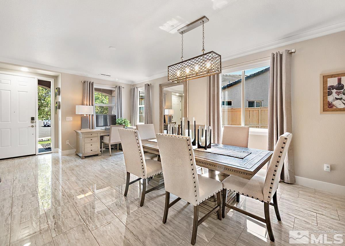 2552 Country Falls Lane Reno, NV 89521 - Photo 17 of 40 a view of a dining room with furniture window and wooden floor