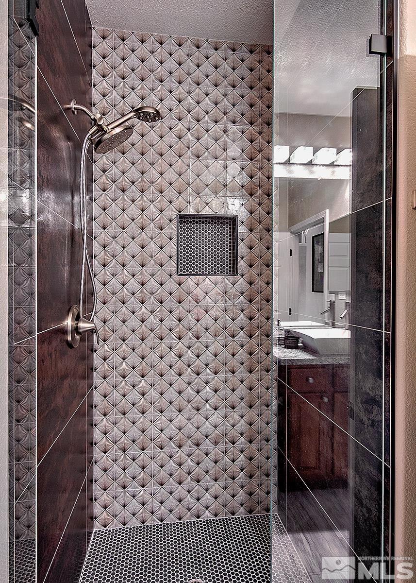 2552 Country Falls Lane Reno, NV 89521 - Photo 23 of 40 a bathroom with a sink and a mirror
