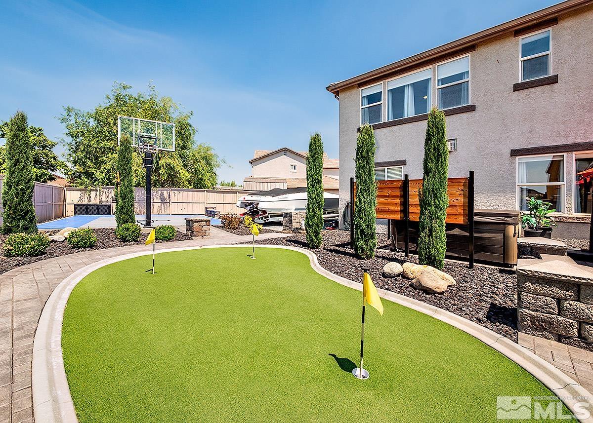 2552 Country Falls Lane Reno, NV 89521 - Photo 30 of 40 a swimming pool with outdoor seating and yard