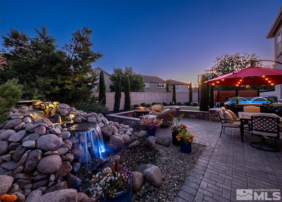 2552 Country Falls Lane Reno, NV 89521 - Photo 33 of 40 a view of a chairs and tables in the patio