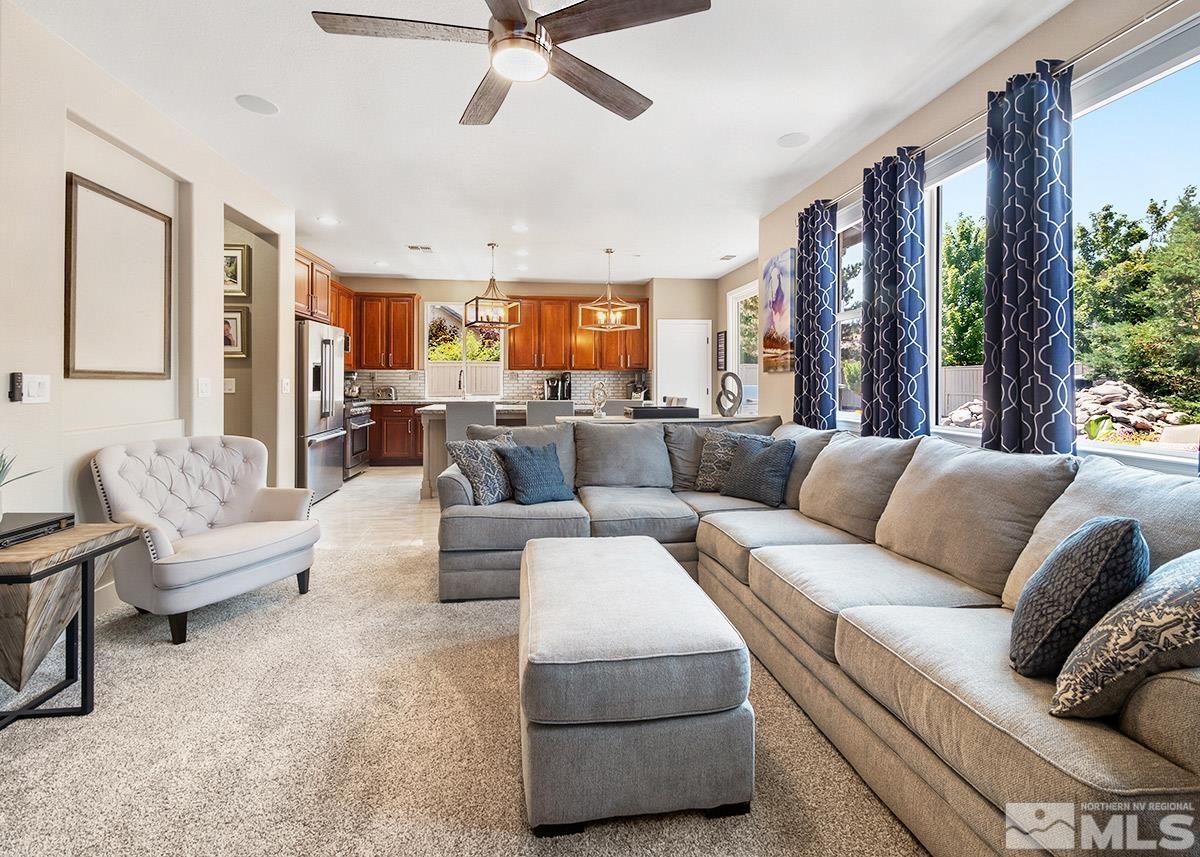 2552 Country Falls Lane Reno, NV 89521 - Photo 8 of 40 a living room with furniture and a large window