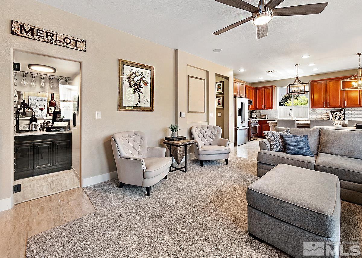 2552 Country Falls Lane Reno, NV 89521 - Photo 9 of 40 a living room with furniture and a view of kitchen