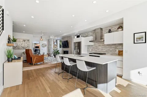 a kitchen with stainless steel appliances kitchen island granite countertop a sink and cabinets