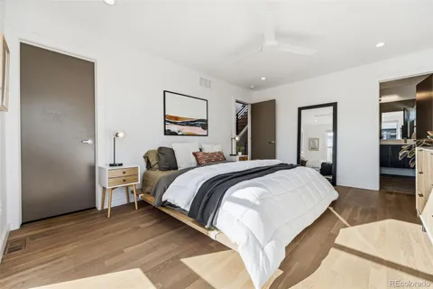 a spacious bedroom with a bed and closet